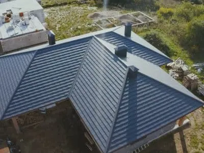 Charcoal standing-seam metal roof on a residential home
